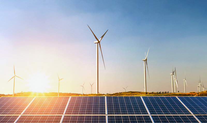 wind turbines over solar panels