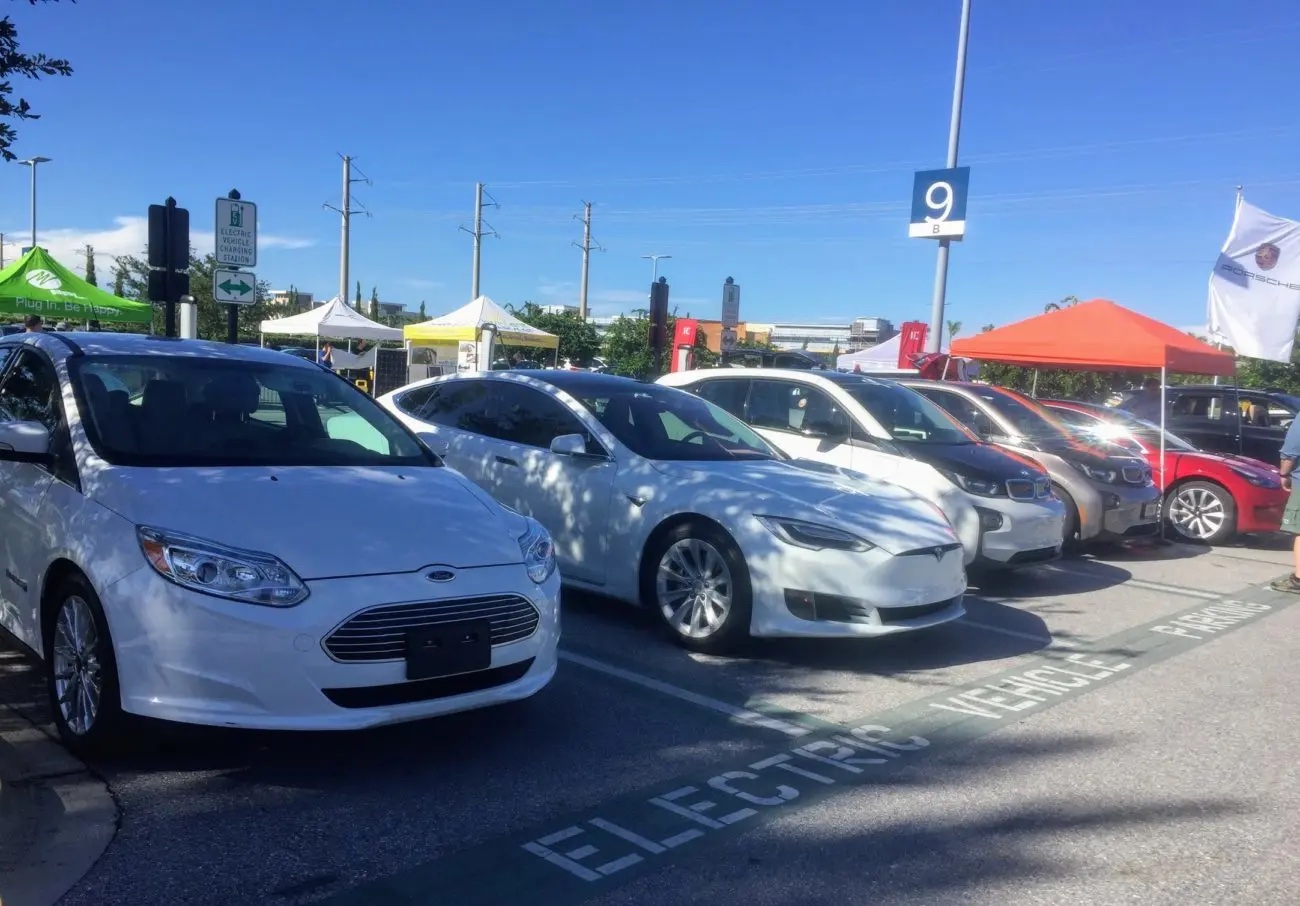 electric vehicles parked in a row at charging station