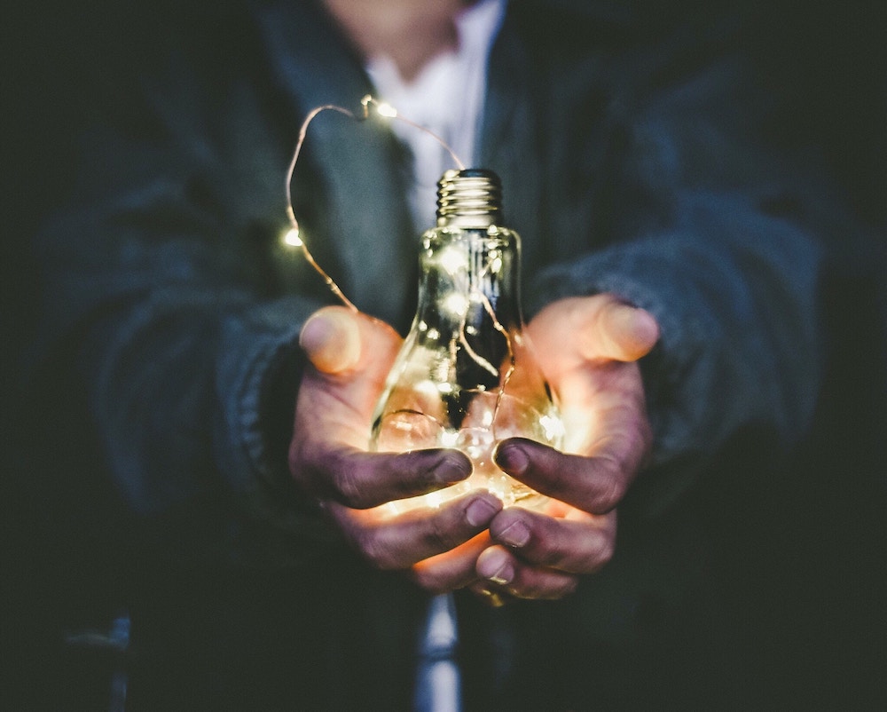 lightbulb in hands