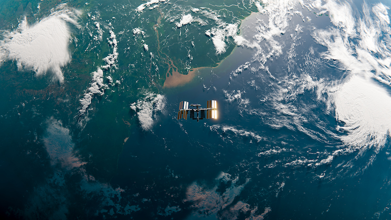 Satellite in space above the earth