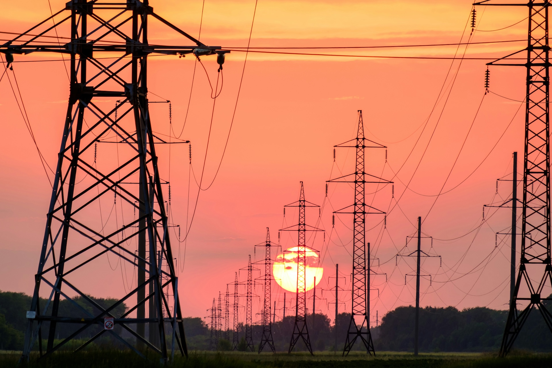 Transmission lines at sunset